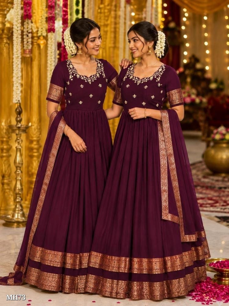 wine color silk blend gown with floral embroidery and zari border wine color silk blend gown with floral embroidery and zari border